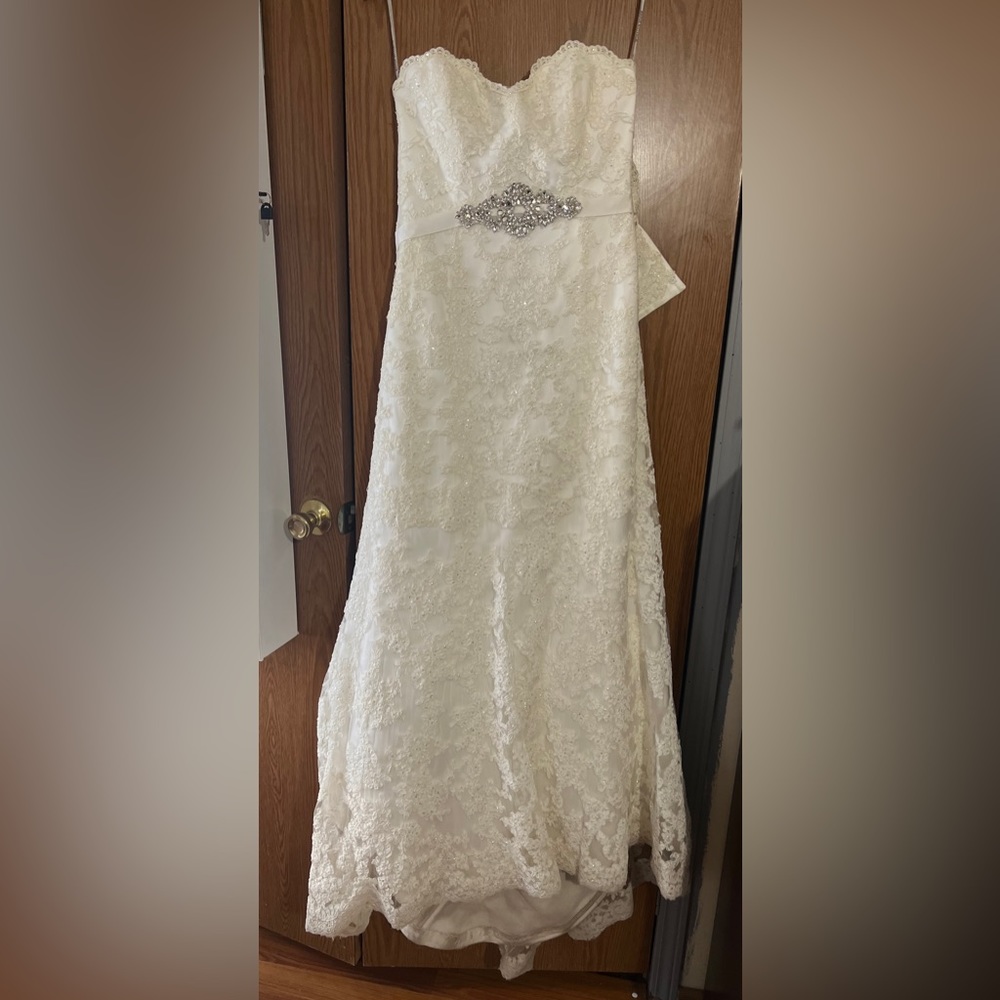 Wedding dress for sale. Includes veil and crown.